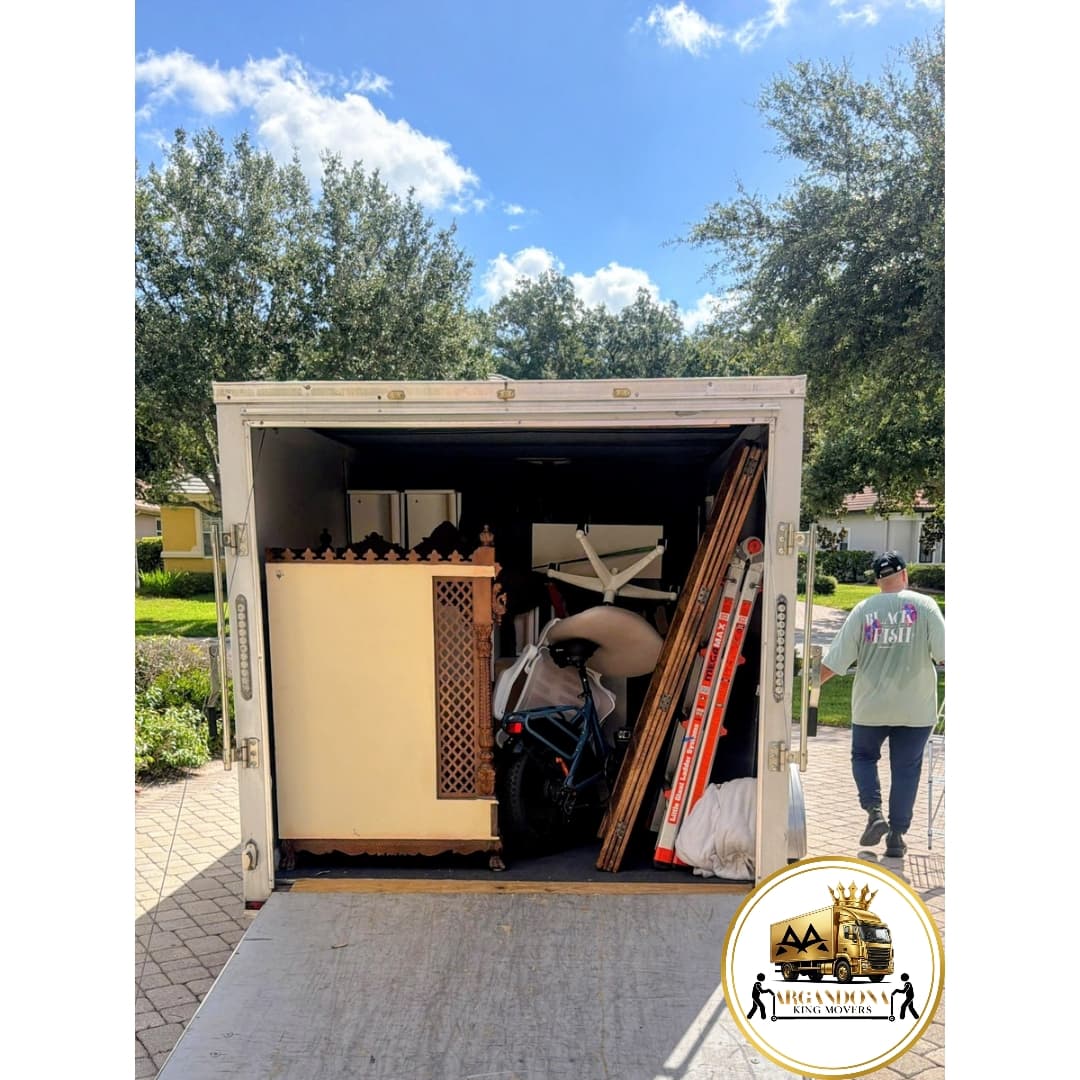 ARGANDONA KING MOVERS loaded trailer with furniture and moving equipment